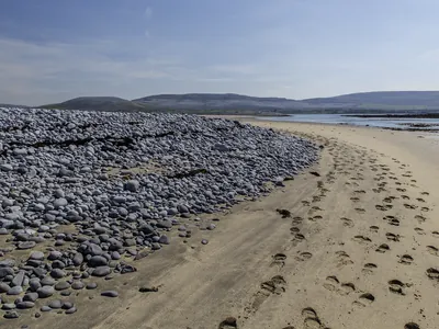 Foot prints in the sand on Burren beach | Burren Guided Walks
