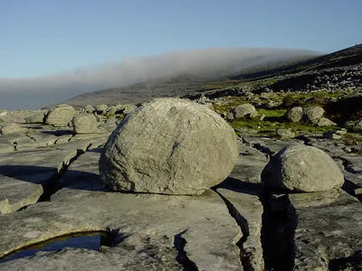 Glacial erratic large boulder on Burren pavement | Burren Guided Walks
