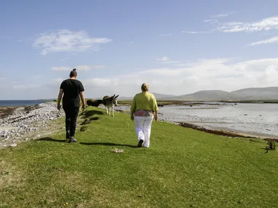 Two people walking near the ocean | Retreat Venue Hire Ireland