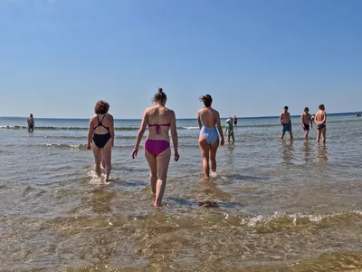 small waves as walk inot sea at Fanore beach in the Burren | yoga teachers retreat